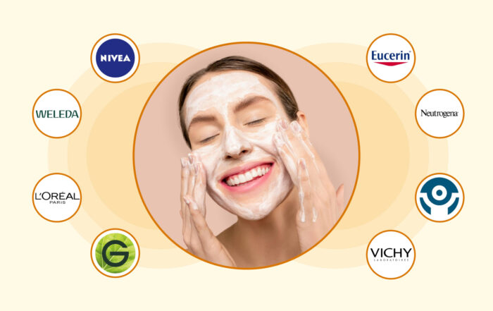 Smiling woman massaging a foamy cleanser onto her face, centered in a circle and surrounded by circular logos of skincare brands including Nivea, Weleda, L’Oréal Paris, Garnier, Vichy, Eucerin, Neutrogena and Cantabria Labs on a pale background.