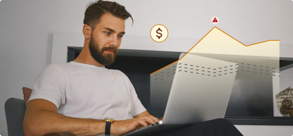 Person using a laptop with an overlaid upward graph and price and alert symbols, indicating performance analysis in the face of market changes.