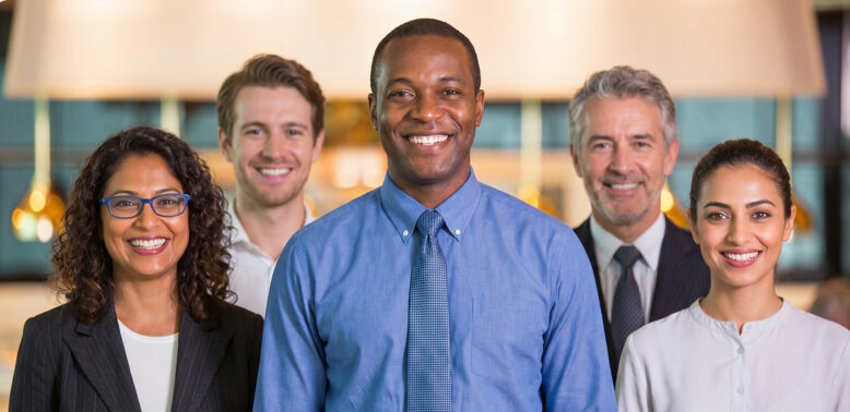 A diverse group of smiling business professionals and corporate team members, representing Flipflow's dedication to client success, collaboration, and expert support in the e-commerce retail intelligence sector.