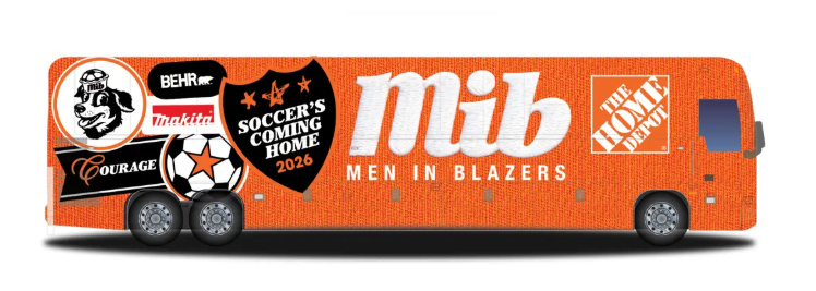 Side of a "Men in Blazers" promotional bus with sponsor logos like Home Depot and Behr, highlighting the slogan "Soccer's Coming Home 2026" for the upcoming 2026 World Cup.